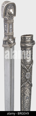 A silver-mounted Caucasian kinjal, circa 1900 Blade with offset fullers on both sides. Hilt made of nielloed silver with filigree mountings (the backside slightly cracked and soldered). Silver scabbard, the obverse side with niello and embossed decoration. Length 45.5 cm., historic, historical, 1900s, 20th century, 19th century, Ottoman Empire, thrusting, thrustings, blade, blades, melee weapon, melee weapons, hand weapon, hand weapons, handheld, weapon, arms, weapons, arms, object, objects, stills, clipping, clippings, cut out, cut-out, cut-outs, Additional-Rights-Clearences-Not Available Stock Photo