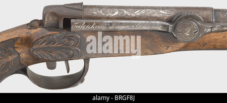 A Dreyse needle-fire front-loading pistol no.2,circa 1828.Round iron barrel,staged in the middle with the step decorated by a corded ring just like the muzzle.Smooth bore in calibre 14 mm.Iron front sight on disk.Almost the complete barrel surface and muzzle in vine engravings,flashes of lightning and rays in silver inlay,in front half marked 'N.Dreysens Patentierte Zündnadel Pistole'.The cocking mechanism on the side labelled 'Fabrick von Dreyse und Collenbusch in Soemmerda',in the middle serial no.'2'.Carved walnut stock with checkered grip and l,Additional-Rights-Clearences-Not Available Stock Photo