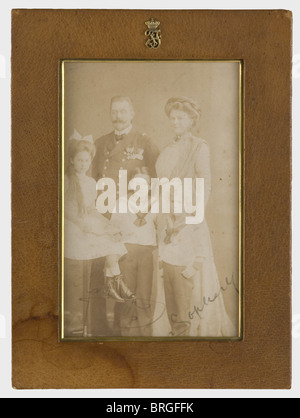 Archduke Franz Ferdinand of Austria-Este and Duchess Sophie von Hohenberg, a dedicated photograph in a presentation frame A family photo with the three children, Sophie, Maximilian, and Ernst. Franz Ferdinand in his admiral's uniform. Ink signatures on the lower edge, 'Franz' and 'Sophie'. In a leather stand-alone frame on replacement cardboard. A superimposed 'FF' monogram beneath an archduke's crown on the frame. 24.5 x 18.5 cm. Rare dedicated photograph from circa 1910/12., people, 1910s, 20th century, object, objects, stills, clipping, clippings, cut out, c, Stock Photo