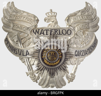An emblem for the czapka for officers,of the King's own Uhlan Regiment(1st Hanoverian)No.13,Prussian Guards' eagle plated with frosted white silver,and the scroll 'Peninsula - Waterloo - Garzia-Hernandez' in sunken black script.With a screw-mounted,small Star of the High Order of the Black Eagle.The inscription on the medallion and the background to the eagle are gilded,the eagle is enamelled.Stamped nickel-silver plate with the original mounting washers and nuts.This emblem was worn after 24 January 1899.Outstanding condition,possibly never worn.,Additional-Rights-Clearences-Not Available Stock Photo