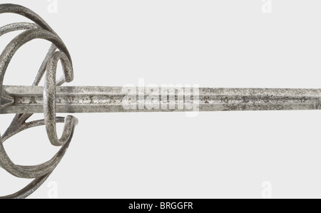 A German rapier,circa 1600 Slender thrusting blade of flattened hexagonal section,shortened at the base. Signed 'DE HORTUNO DE AGUIR EN TOLEDO' in the fuller. Swept hilt with knucklebow and slightly tapered octagonal quillons. Grip cover has replacement iron wire winding and braided ferrules. Oval pommel with decorative chasing. Assembled from old pieces. Length 100 cm.,historic,historical,,17th century,sword,swords,weapons,arms,weapon,arm,fighting device,military,militaria,object,objects,stills,clipping,clippings,cut out,cut-out,cut-outs,,Additional-Rights-Clearences-Not Available Stock Photo