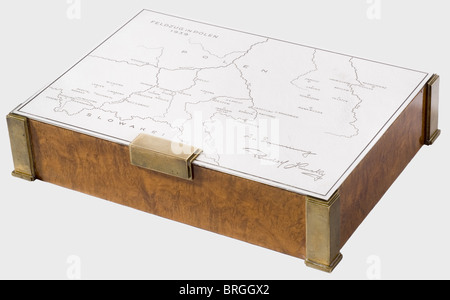 A silver presentation cigarette box for the 1939 Polish campaign,10th Mounted Rifles Regiment Cedar with figured amboine veneer.Brass corners and feet.Silver lid engraved with a map of Poland and 'Feldzug in Polen 1939'(Campaign in Poland 1939)on the upper left,and 'In Erinnerung Rudolf Kinsky'(In Memory - Rudolf Kinsky)at the lower right.There is a detailed enumeration of the(transl.)'Movements and Actions Fought by the 10th Mounted Rifle Regiment from 1 September to 24 September 1939' inside.The silversmith's signature 'Carl Hiess Wien I',the hal,Additional-Rights-Clearences-Not Available Stock Photo