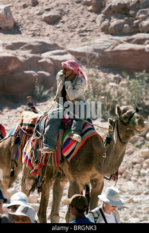 Bedouin camel riders, Petra, Jordan. Stock Photo