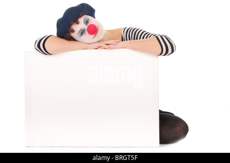 Young woman wearing clown face holding billboard isolated on white Stock Photo