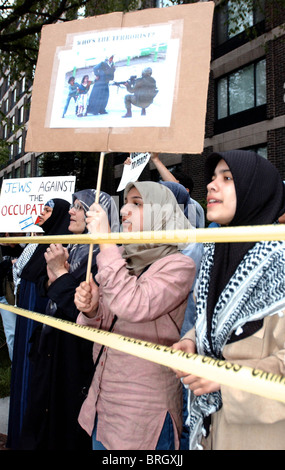 Protesters gather outside the hotel where Prime Minister of Israel, Ariel Sharon speaks in Washington. Stock Photo