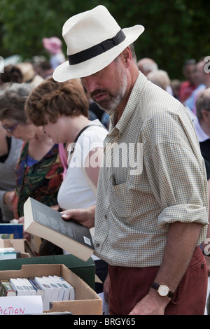 Buying second hand books at the annual summer Charminster Fete, in the Dorset village of Charminster. DAVID MANSELL Stock Photo