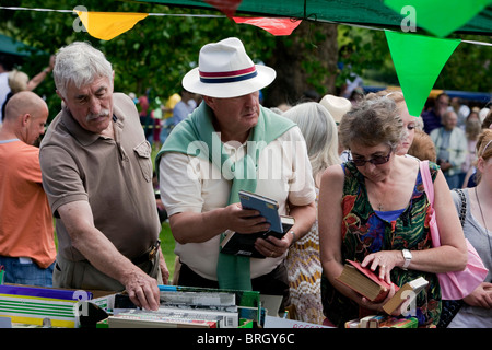 Pensioners buying second hand books at the annual summer Charminster Fete, in the Dorset village of Charminster. DAVID MANSELL Stock Photo