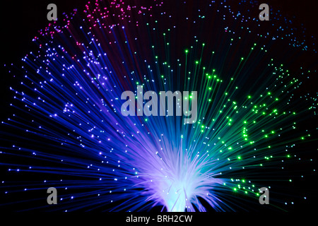 illuminated colorful optic fiber lamp on black background Stock Photo