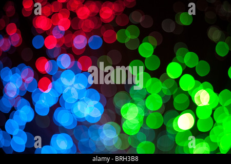 colorful defocused christmas lights under black background Stock Photo