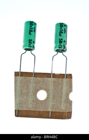 electrolytic radial capacitors on bandolier Stock Photo