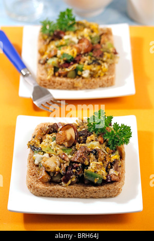 Scrambled eggs with mushroom and spring garlics.  Recipe available. Stock Photo