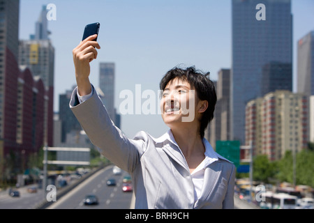 Businesswoman in an urban scene Stock Photo