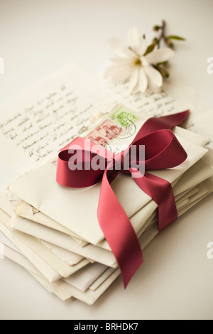 Stack of Letters Tied With Ribbon Stock Photo