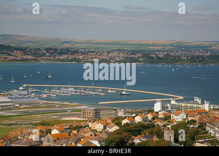 Looking west from the Isle of Portland over Portland harbour and the town of Fortuneswell, Dorset, England UK Stock Photo