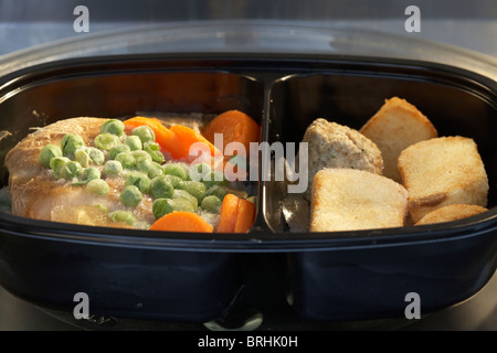 frozen microwave chicken dinner meal for one in a microwave ready to cook Stock Photo