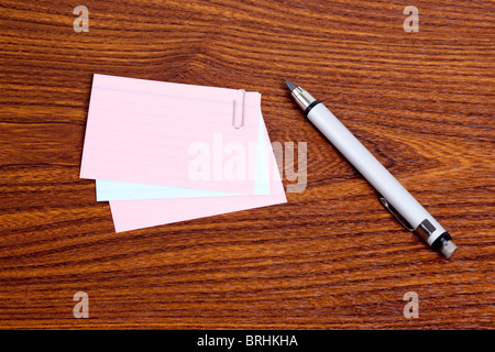 Pen and Papers on Desk Stock Photo