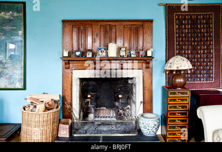 Old fireplace in the drawing room of an old country village house in Wiltshire, England, UK Stock Photo