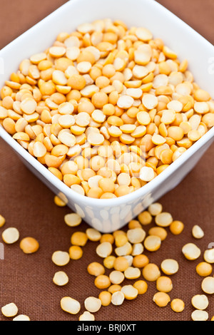 Yellow split peas in a white bowl Stock Photo