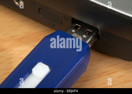4GB usb stick connected to a laptop computer Stock Photo