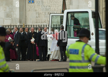 Pope Benedict XVI  arrives in Popemobile outside Westminster Abbey. He is greeted by  Roman Catholic Archbishop Vincent Nichols. Stock Photo