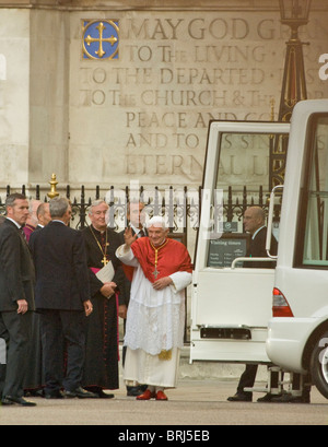 Pope Benedict XVI arrives in Popemobile outside Westminster Abbey. He is greeted by  Roman Catholic Archbishop Vincent Nichols. Stock Photo