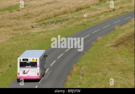 Dartmoor National Park Devon England UK A public service bus enroute across the famous parkland
