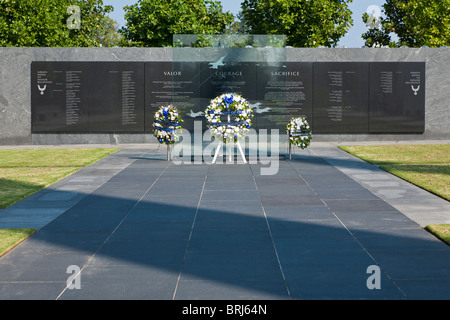 Wreaths of flowers stand in front of memorial wall in memory of fallen Air Force servicemen at the Air Force Memorial Stock Photo