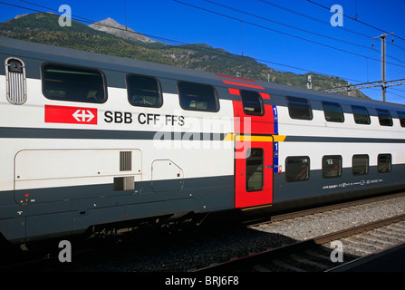 Double decker Swiss railway train at Brig station Stock Photo