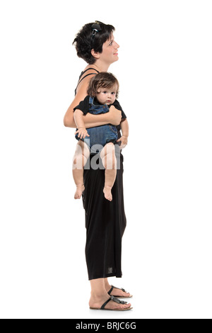 Full length portrait of woman with her baby boy waiting in line Stock Photo