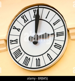 Ancient clock on the wall Stock Photo