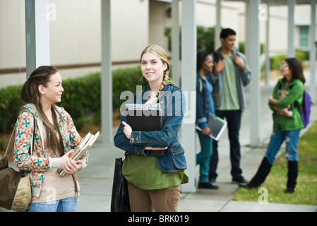 High school students chatting together after school Stock Photo