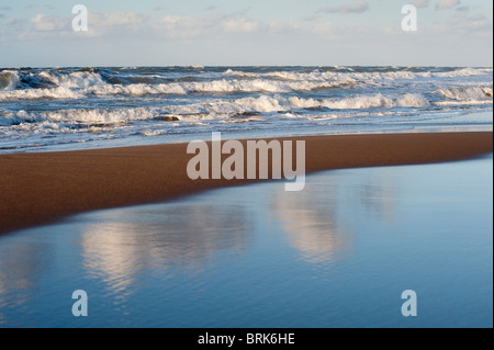 Rough sea waves breaking on beach Stock Photo