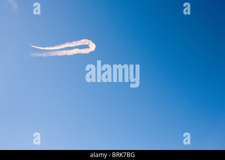 A member of the Red DEvils parachute display team in a bright clear blue sky. Stock Photo