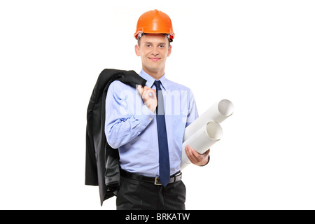 A view of a foreman wearing helmet and holding blueprints Stock Photo