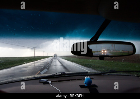 View form the dash of a storm chaser's vehicle as he closes in on a severe thunderstorm in Kansas, May 23, 2010. Stock Photo