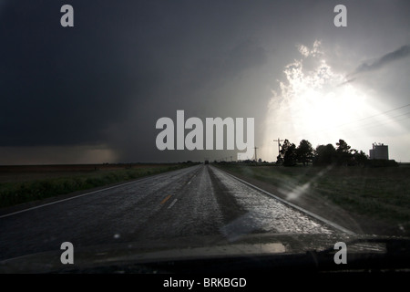 View form the dash of a storm chaser's vehicle as he closes in on a severe thunderstorm in Kansas, May 23, 2010. Stock Photo