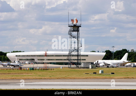 Radar Tower and TAG Aviation Terminal, London Farnborough Airport, Farnborough, Hampshire, UK. Stock Photo