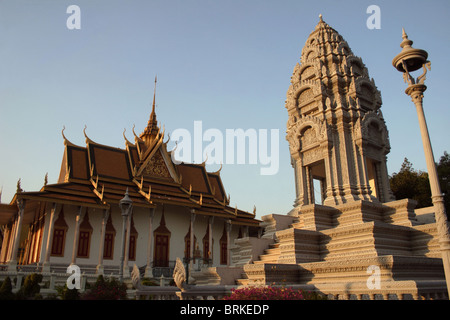 An ancient Buddhist stupa is illuminated by late afternoon sun at The Royal Palace Museum complex in Phnom Penh, Cambodia. Stock Photo