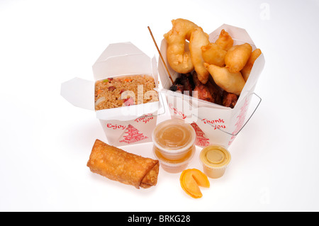 Chinese food take away meal boxes of pork fried rice, chicken fingers & wings, eggroll & beef teriyaki with dipping & soy sauce. Stock Photo