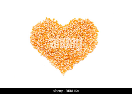 Bright corn kernels arranged in a heart shape Stock Photo