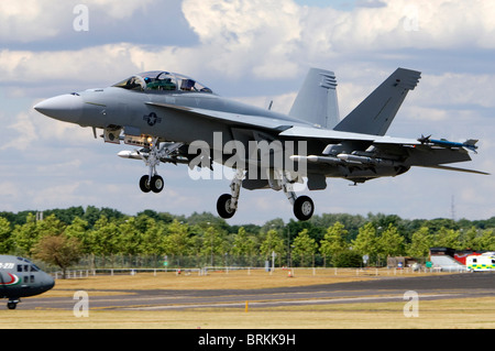 Boeing F/A-18F Super Hornet jet fighter operated by the US Navy landing at Farnborough Airshow, Farnborough, UK. Stock Photo