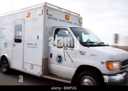 The National Severe Storms Laboratory mobile field command unit races past while on pursuit of a storm in Kansas, May 23, 2010. Stock Photo