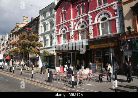 Cardiff Glamorgan South Wales UK Smokers sitting at a pavement cafe in St Mary Street city centre Stock Photo