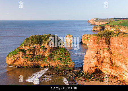 Red sandstone cliffs of Ladram Bay on the Jurassic Coast World Heritage Site, Devon, England. Spring (April) 2010. Stock Photo