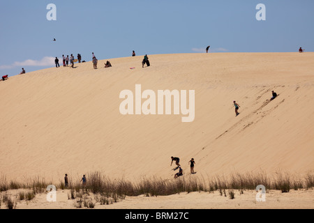 Tourists enjoying the sand dunes at Jockey's Ridge State Park, Nags Head, on the Outer Banks. North Carolina Stock Photo