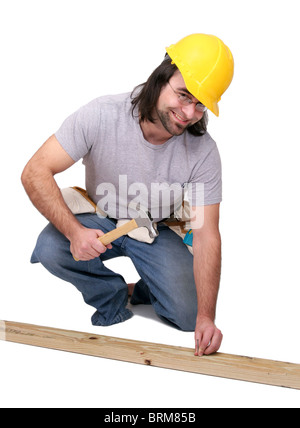 one thirties adult man doing carpentry work over white Stock Photo