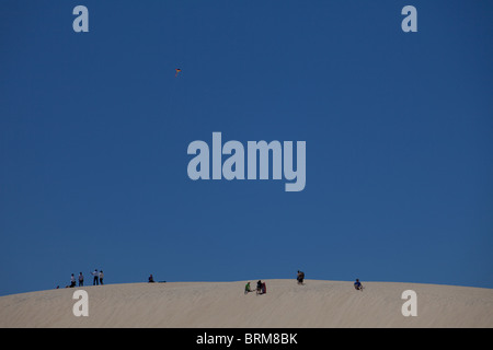 Tourists enjoying the sand dunes at Jockey's Ridge State Park, Nags Head, on the Outer Banks. North Carolina Stock Photo