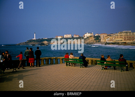 French people, adults, men, women, mature, elderly, seniors, sitting on bench, La Grande Plage, beach, city of Biarritz, Biarritz, Aquitaine, France Stock Photo