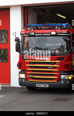 Dorset Fire and Rescue Services responding to an emergency call blue lights - leaving the Fire Station at Westbourne, Bournemouth, Dorset UK in August Stock Photo