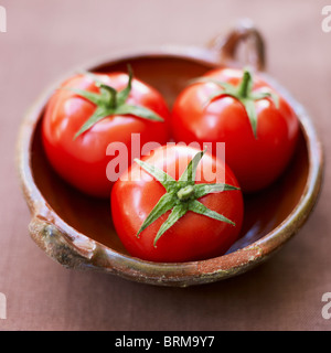 Tomatoes in bowl Stock Photo